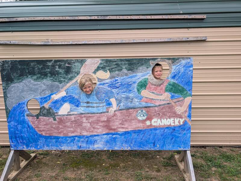 Eve and Noah paddling down the creek