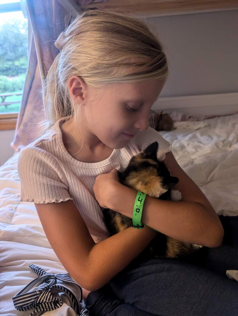 Eve loving her new cat Sweetie