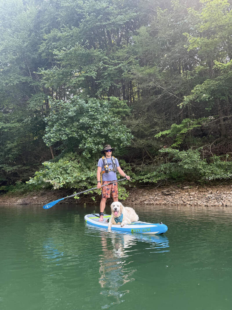 Eric and Summer dog on the paddle board